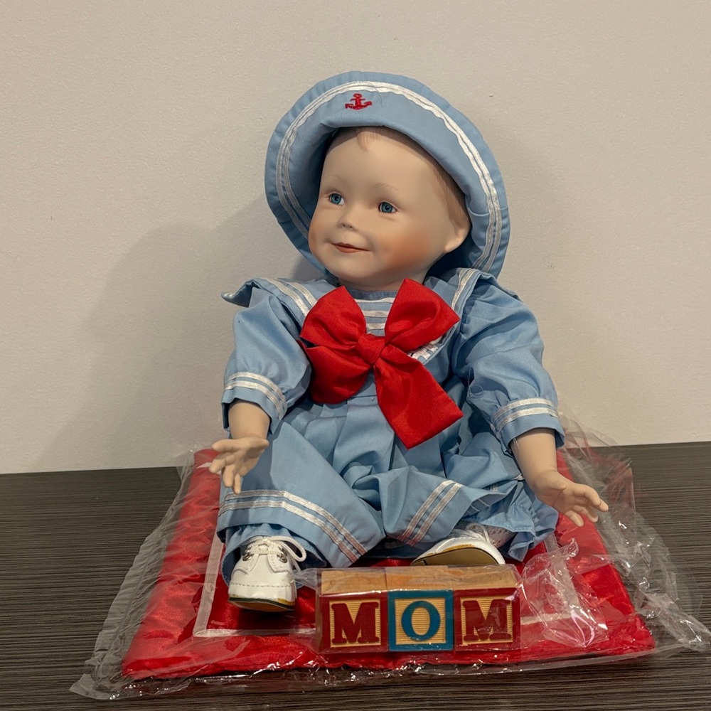 Porcelain Sailor Doll with Red Bow and Blocks